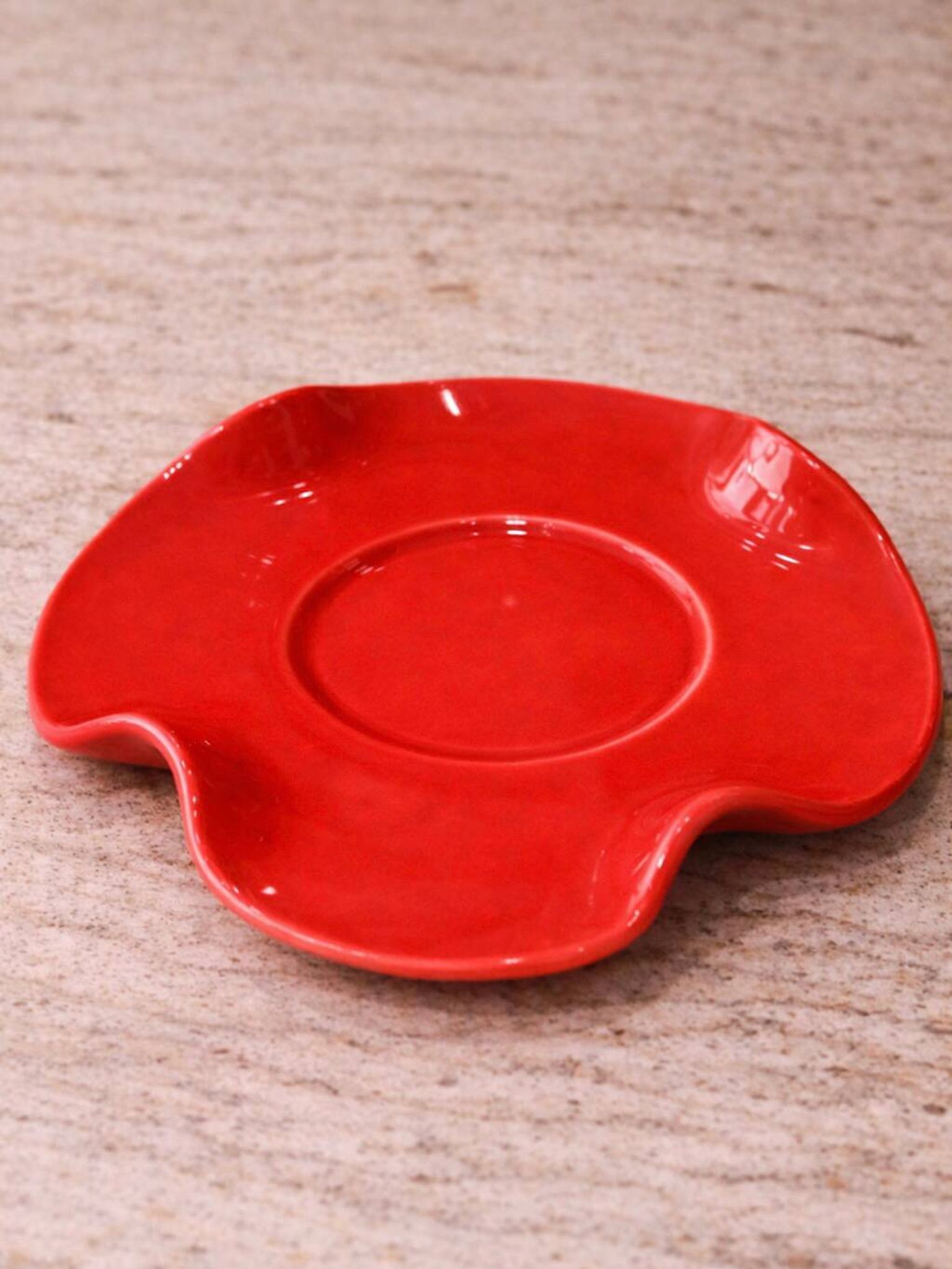 Set of wavy ceramic cup and saucer - poppy red