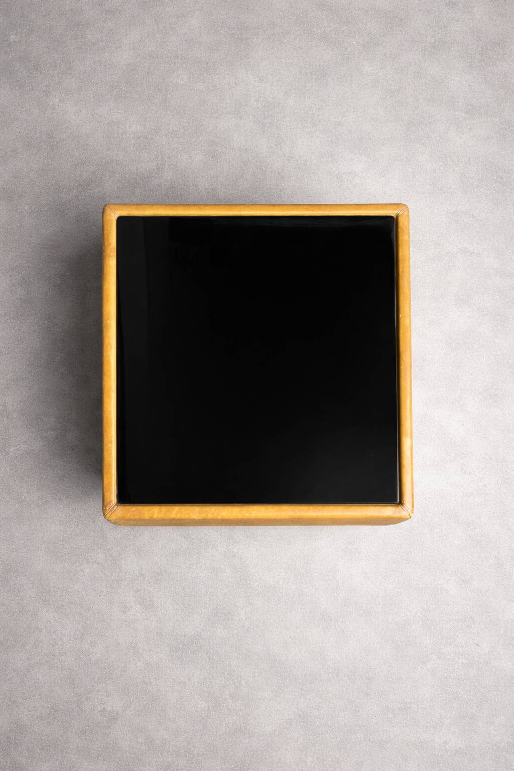 Vintage coffee table in leather and black glass – 1970s