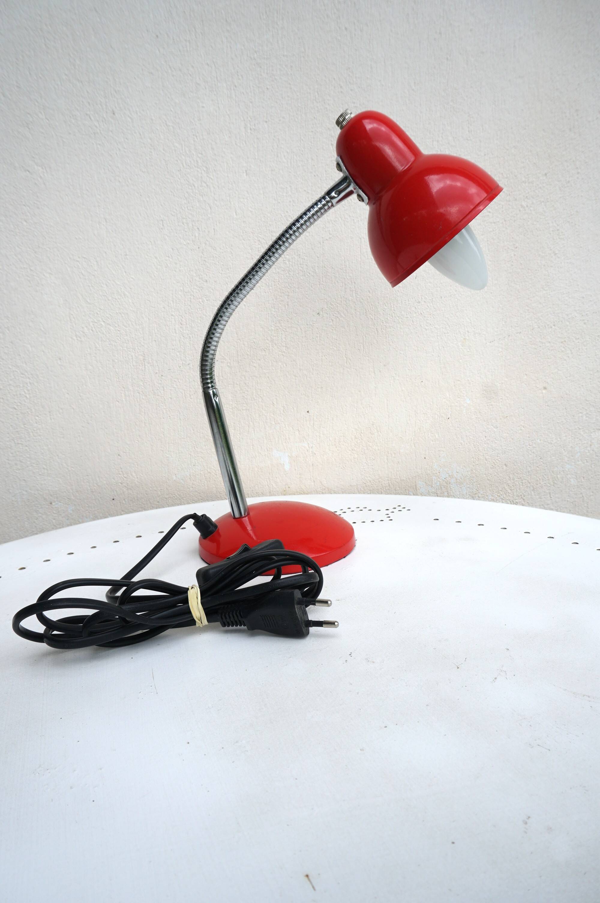 Red flexible metal desk lamp from the 60s