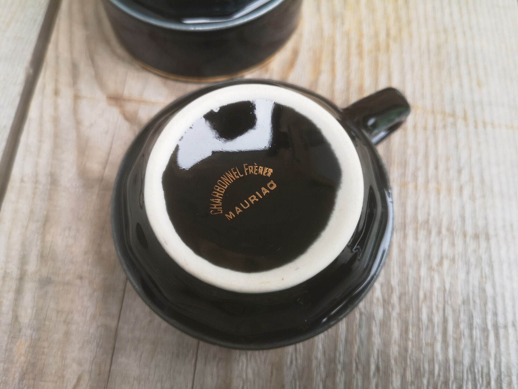 Set of 9 cups and sub-cups in black ceramic and colored gold border