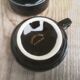 Set of 9 cups and sub-cups in black ceramic and colored gold border
