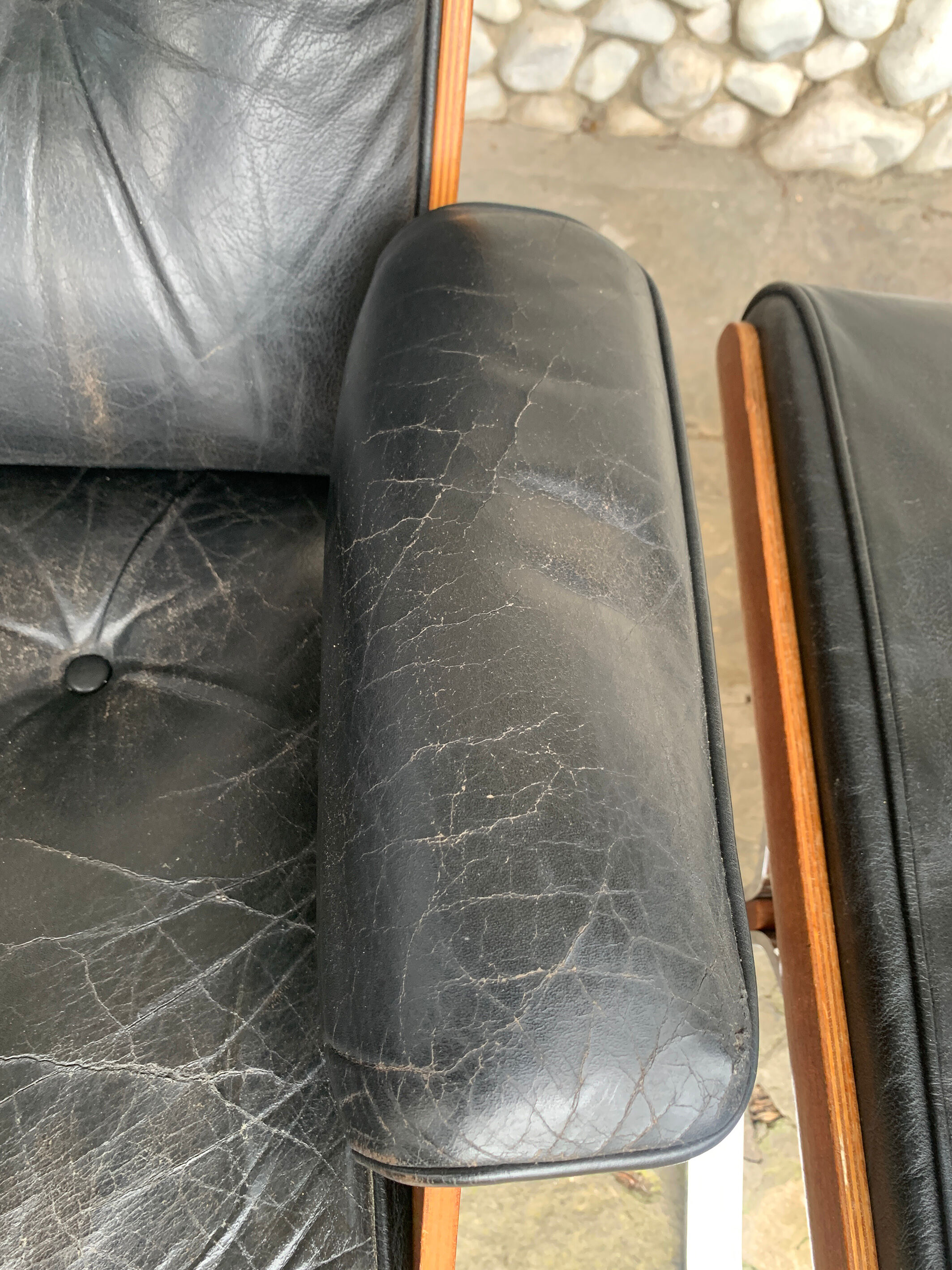 Lounge chair and ottoman black leather and teak multiplex, 1960