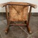 Old armchair, corner chair, made of wood and straw