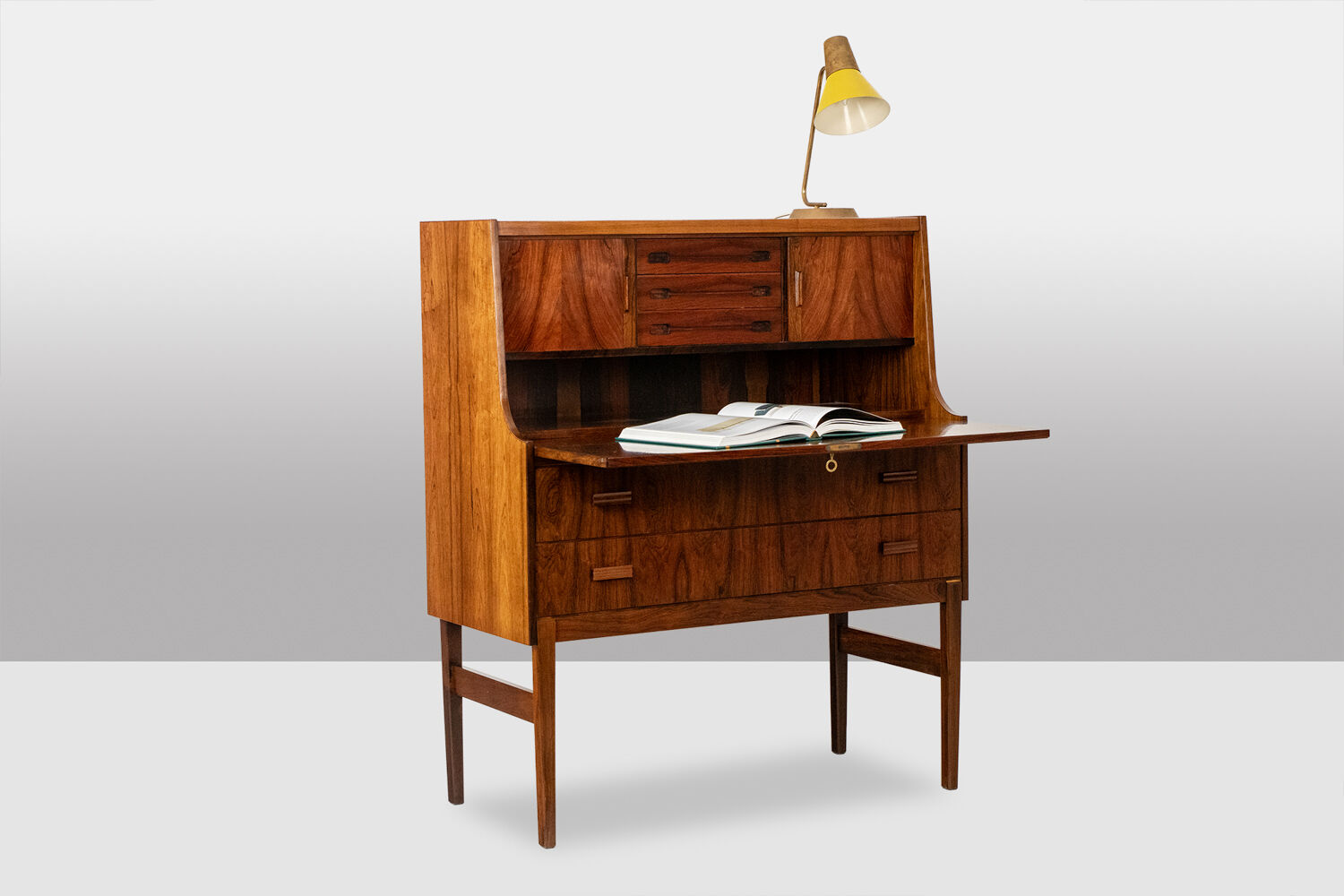 Rosewood chest of drawers with 2 drawers, forming a secretary. 1970s.
