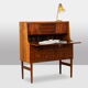Rosewood chest of drawers with 2 drawers, forming a secretary. 1970s.
