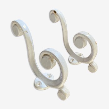 Two art deco cast iron hooks