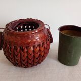 Japanese vase made of woven bamboo. Ikebana.