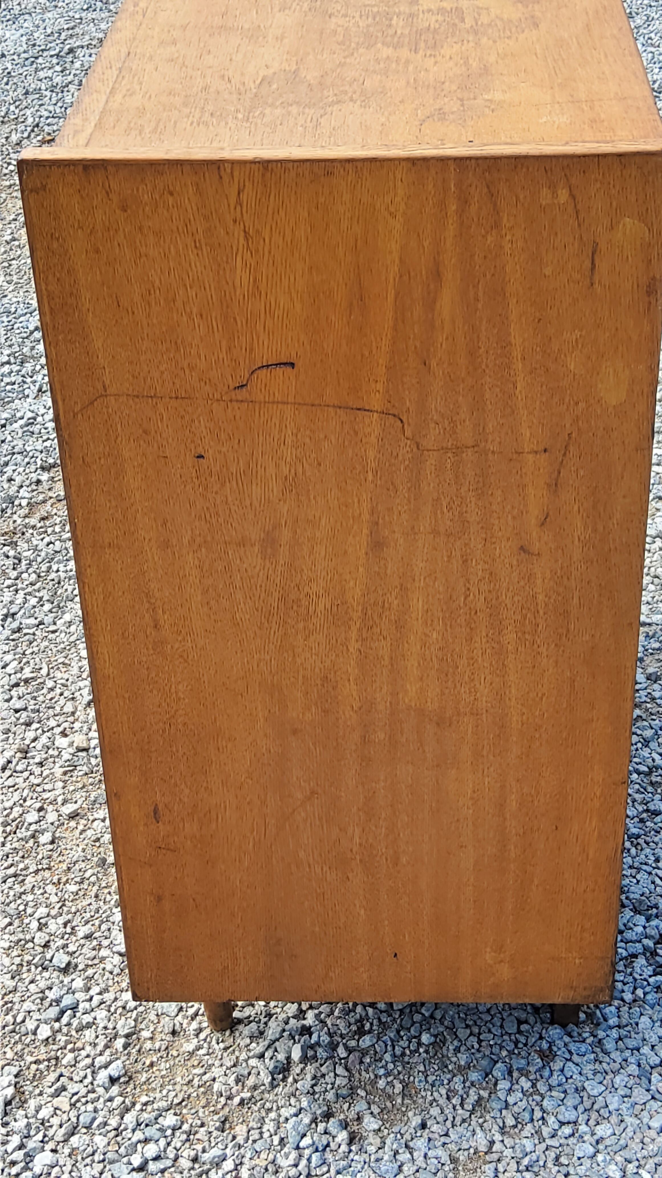 Chest of drawers of the 50s in golden blond oak 5 drawers conical feet