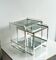 Nested tables in aluminium and smoked glass by Martini & Rossi, 1970s.