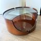 Italian Space Age coffee table in curved wood and smoked glass – 1970s