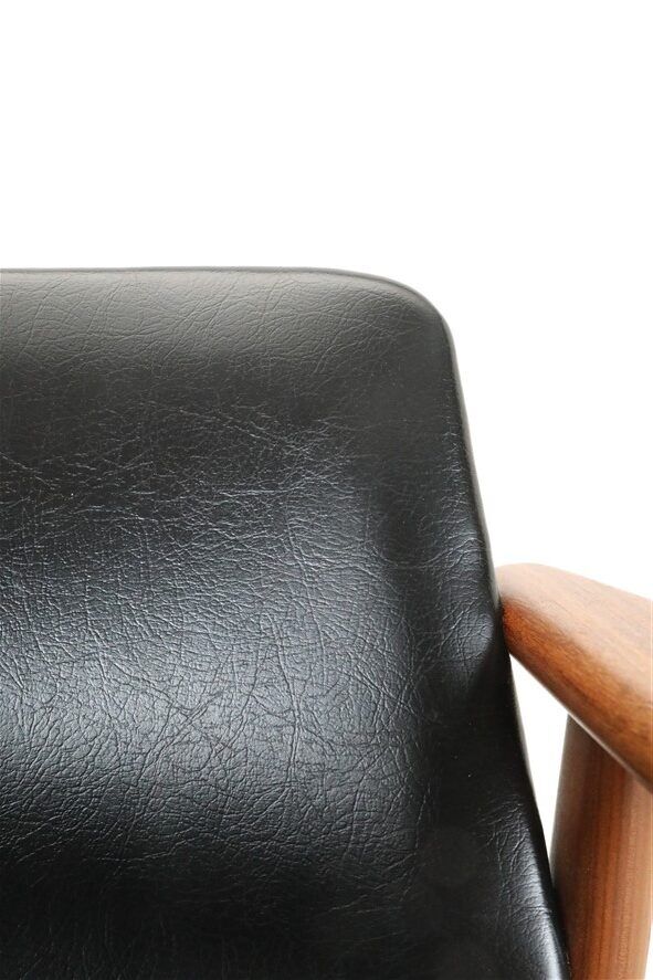 Mid Century Danish Modern teak armchair in the style of Arne Vodder