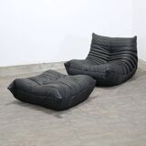 Togo armchair and footrest in black leather by Ligne Roset, designed by Michel Ducaroy.