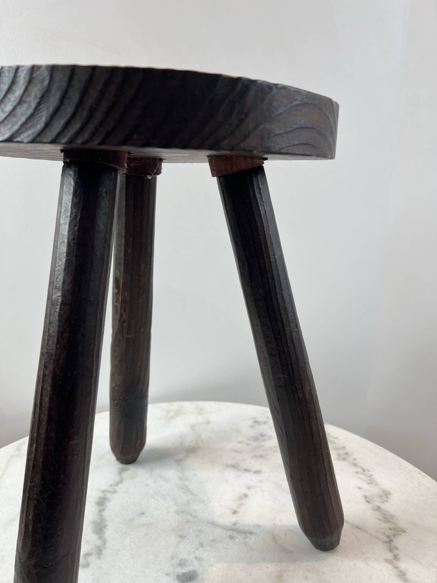 Tripod stool in turned, patinated wood