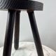 Tripod stool in turned, patinated wood