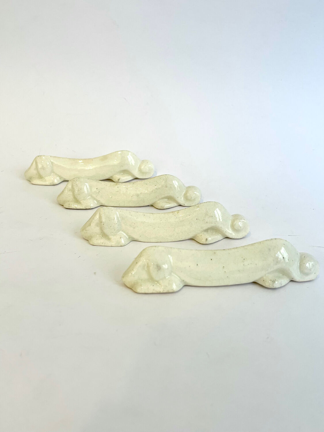 Set of 4 Art Deco knife rests, Primavera workshop