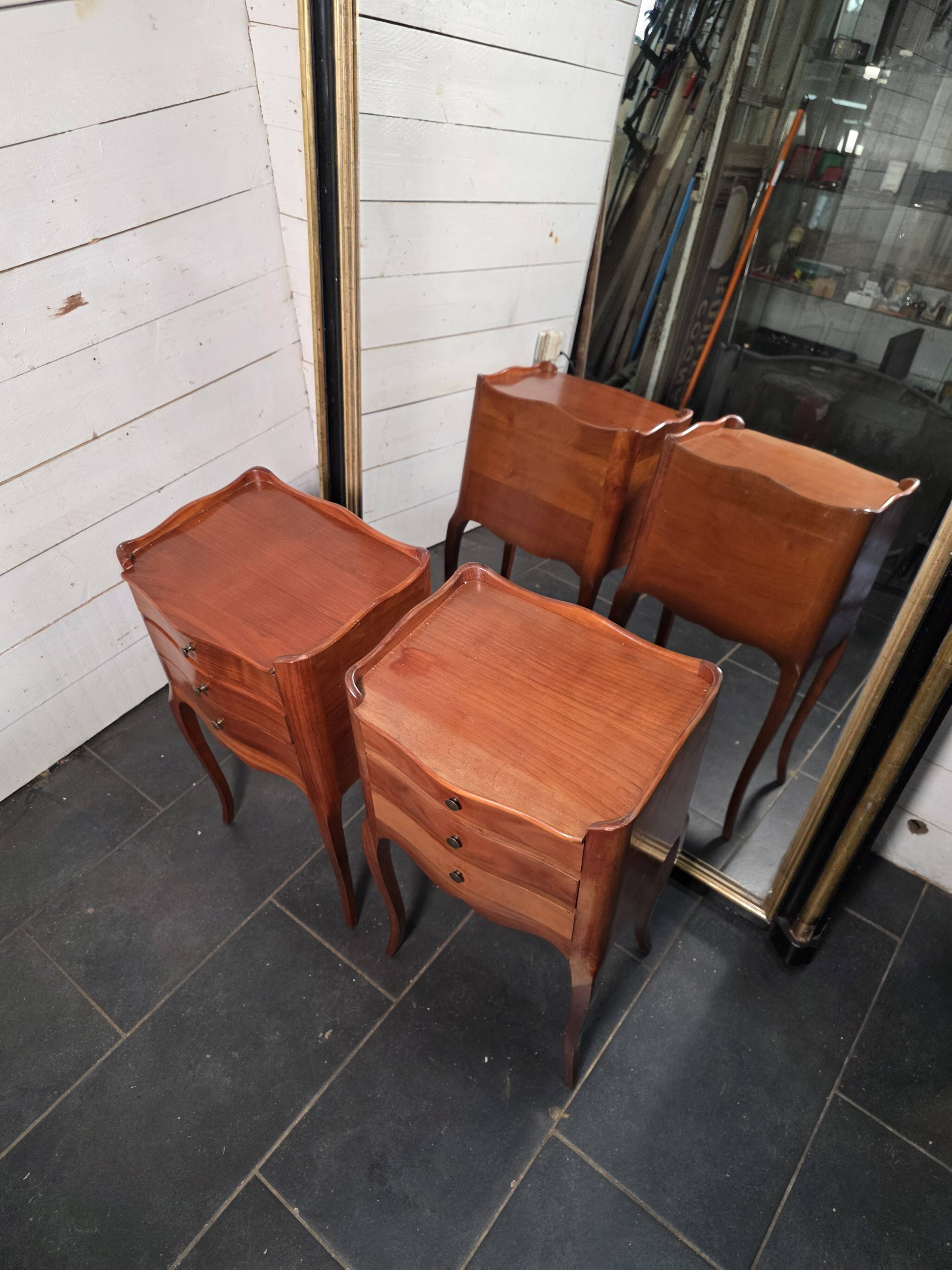 Pair of Louis XV style bedside tables in cherry wood.