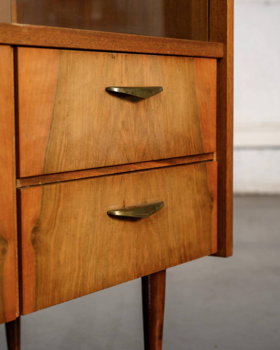 Old TV cabinet with brass handles.