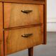 Old TV cabinet with brass handles.