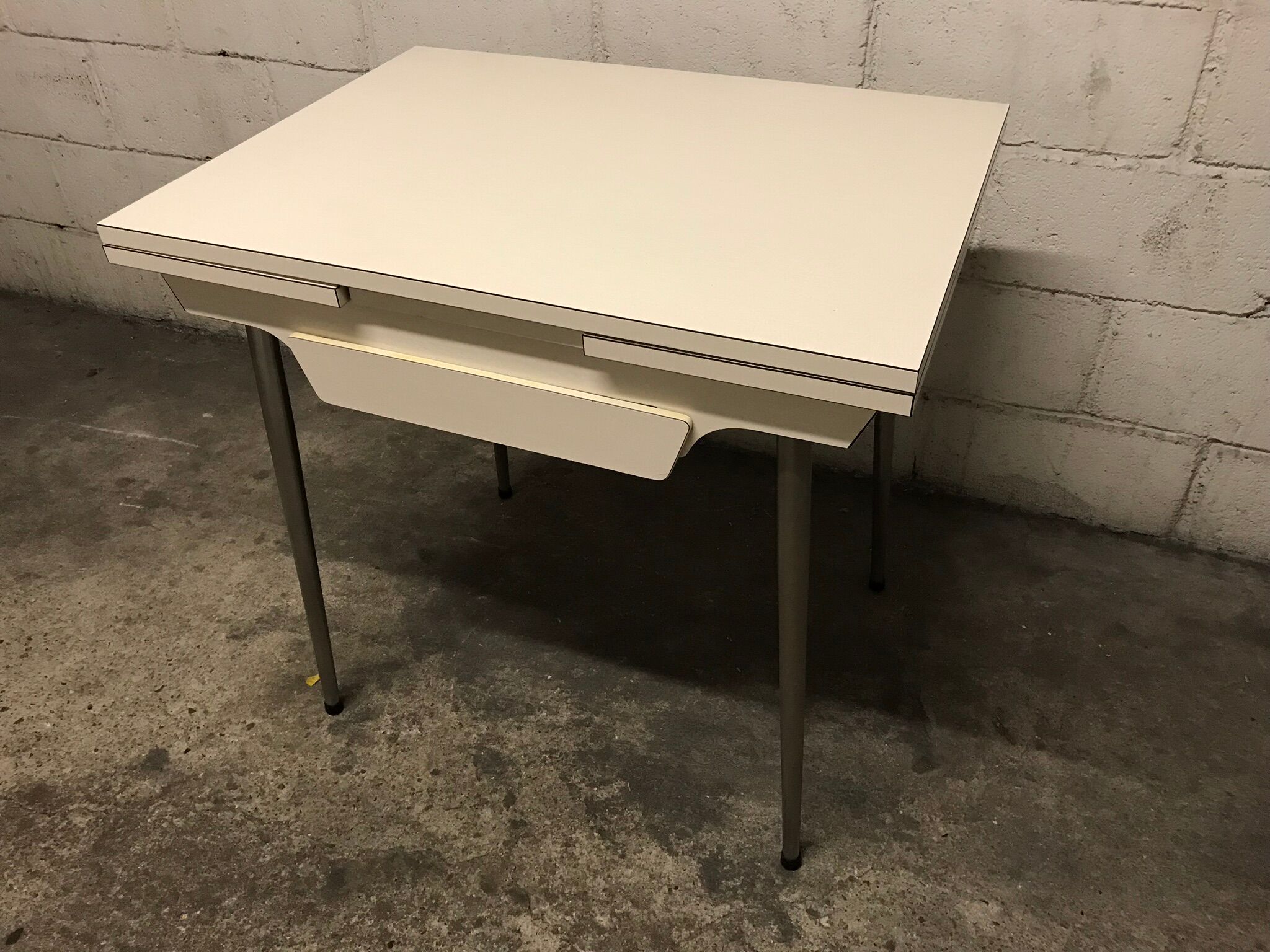 Off-white formica table / 70s cream with a tapered foot drawer