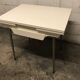 Off-white formica table / 70s cream with a tapered foot drawer