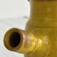 Yellow glazed ceramic sauce boat or milk jug