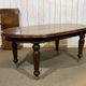 Victorian style oval mahogany table with 1 extension.