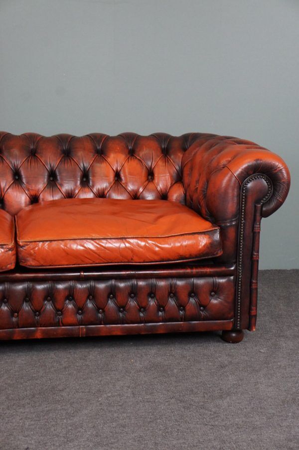 Chesterfield sofa in patinated orange leather, 2.5 seats