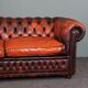 Chesterfield sofa in patinated orange leather, 2.5 seats