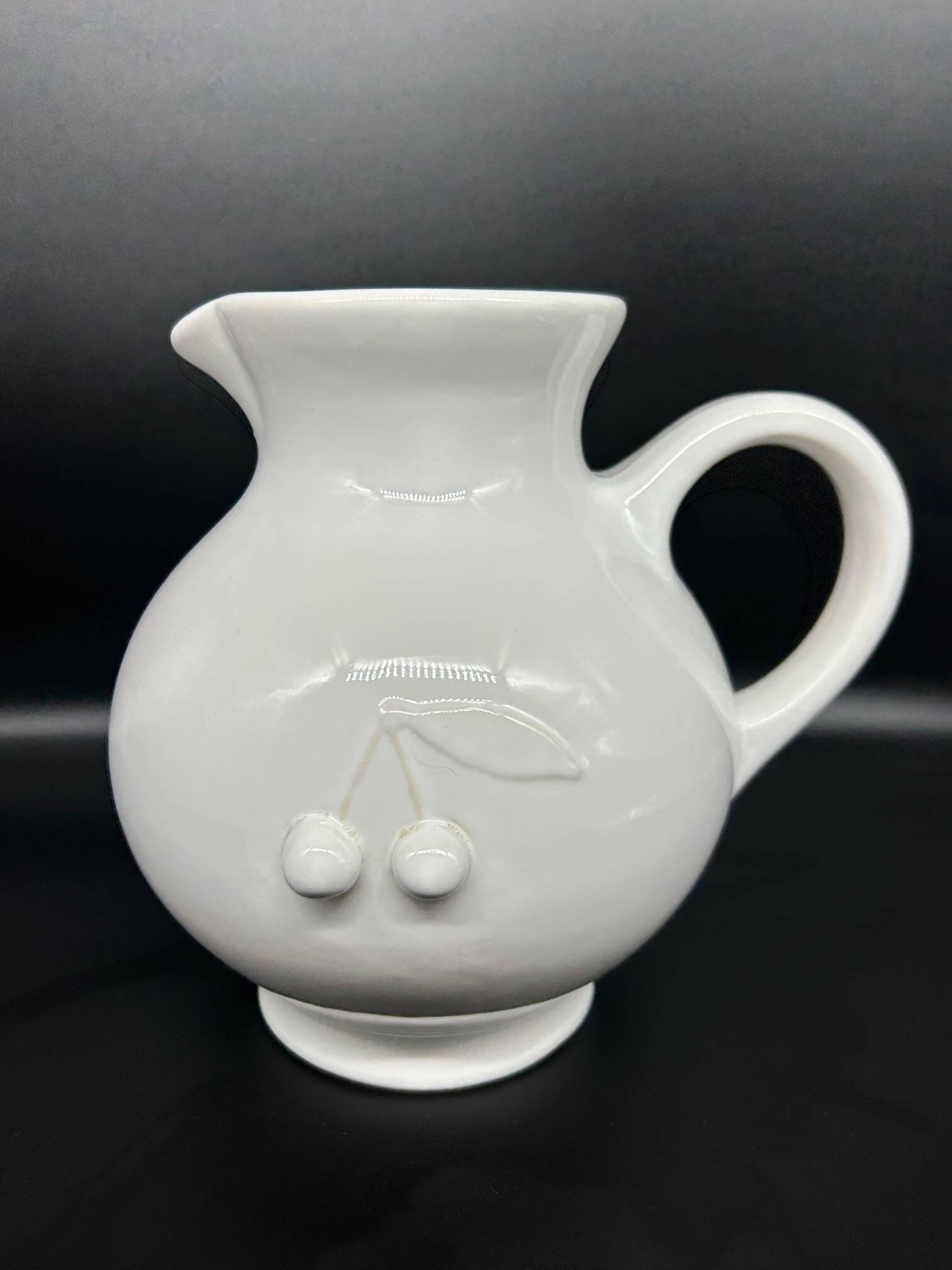 white ceramic cherry jug