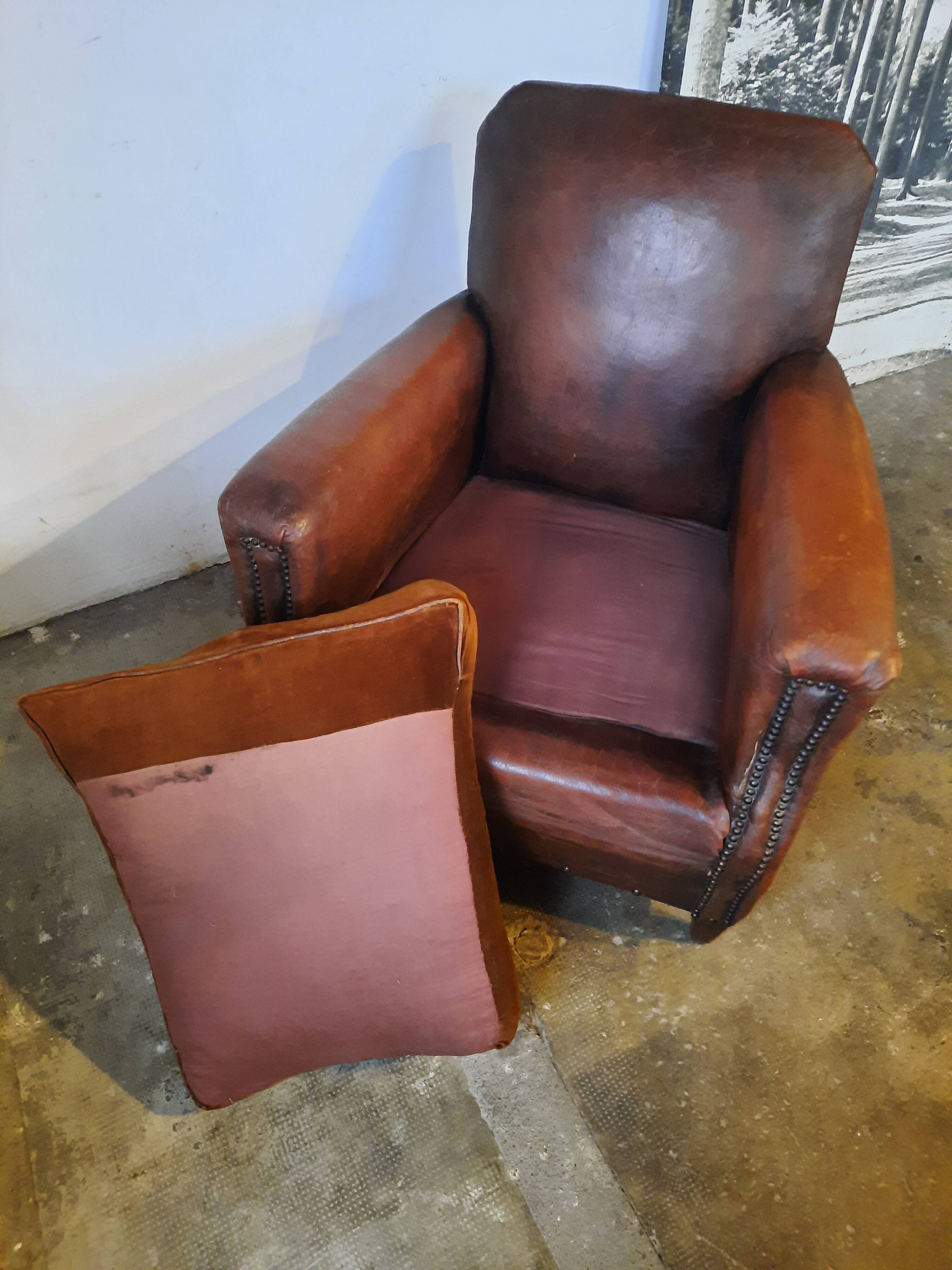 Old studded leather club chair 1930-1930