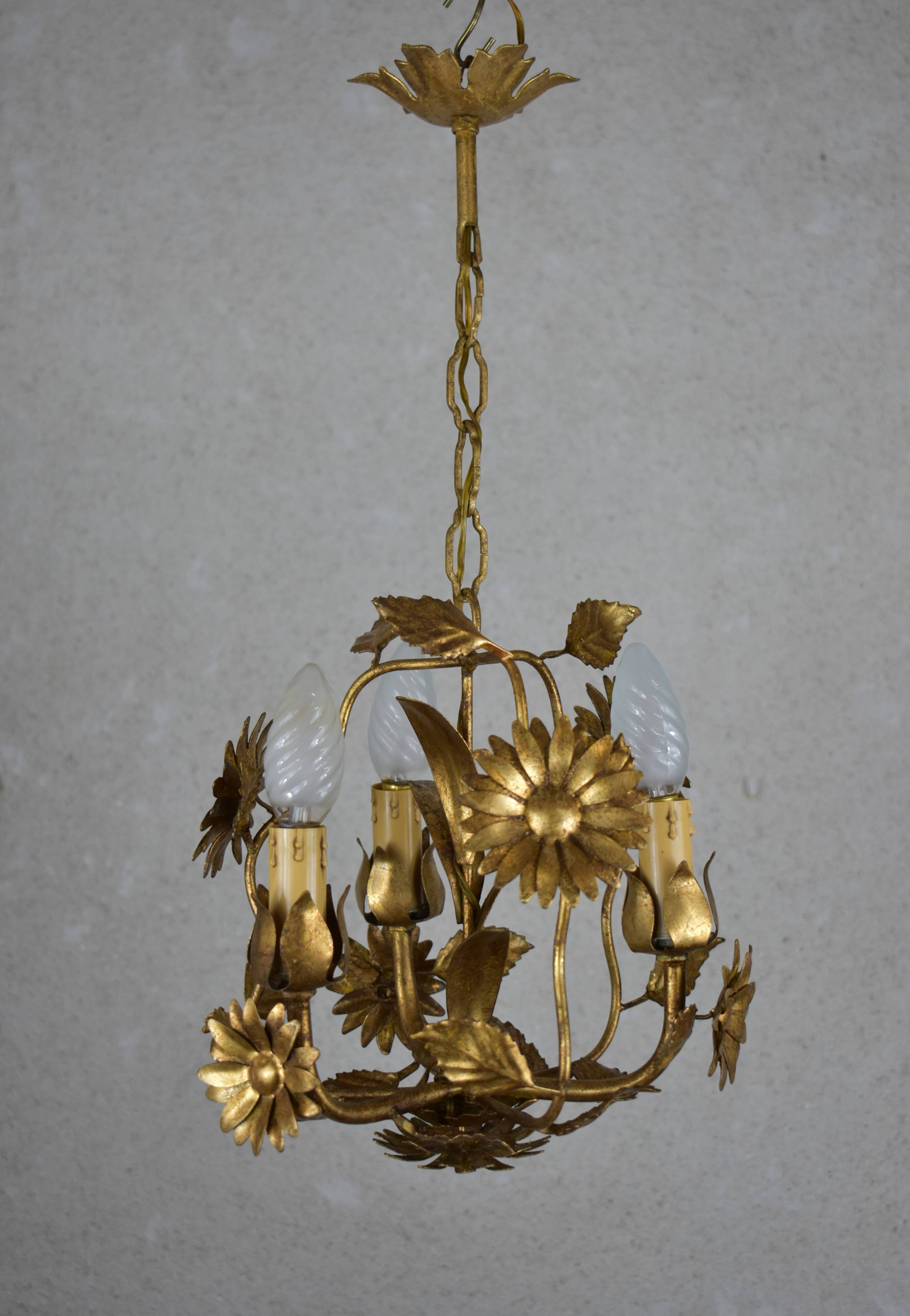 golden chandeliers with flowers.