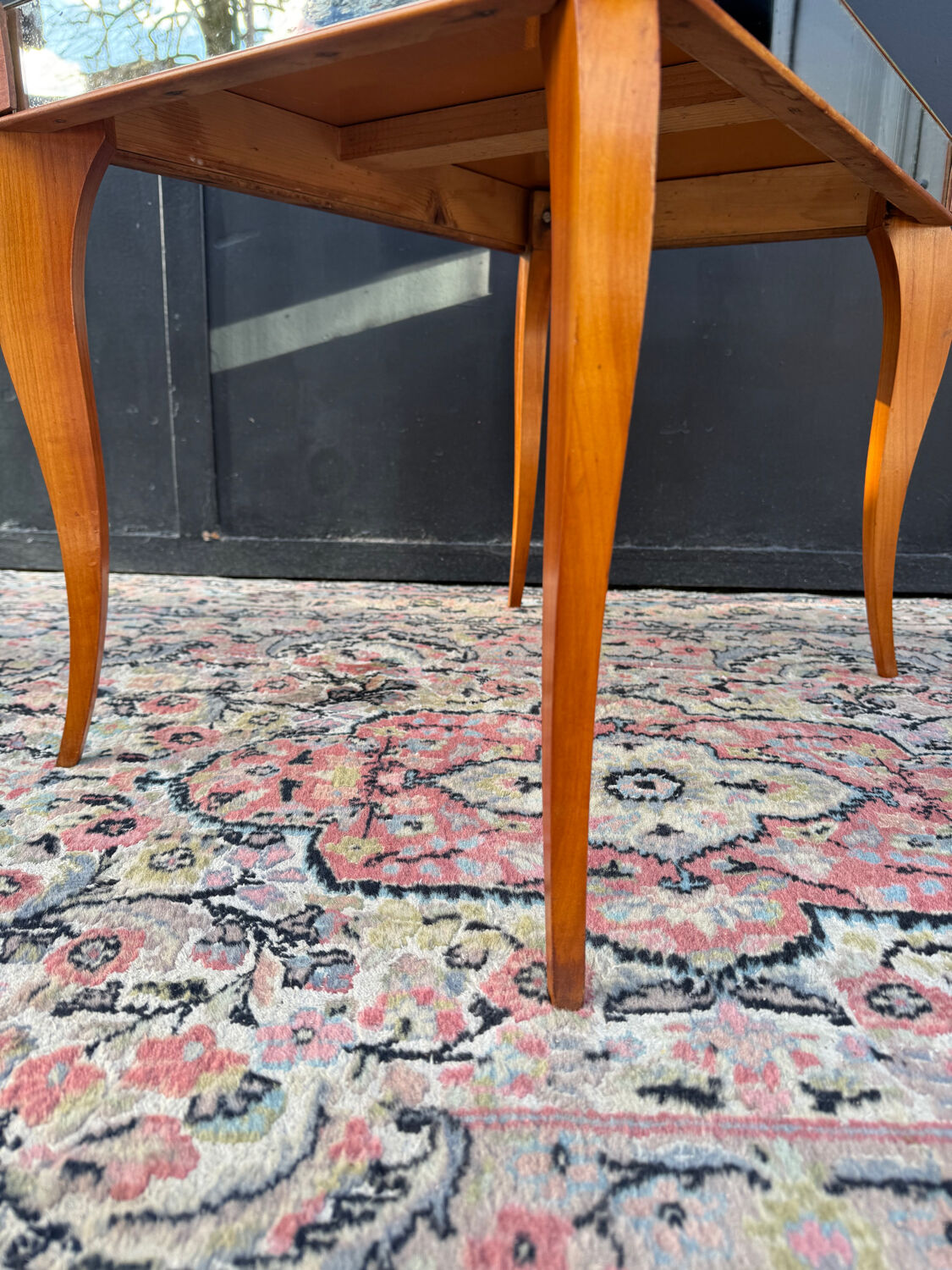 Small wooden coffee table with a mirror from the 1950s.