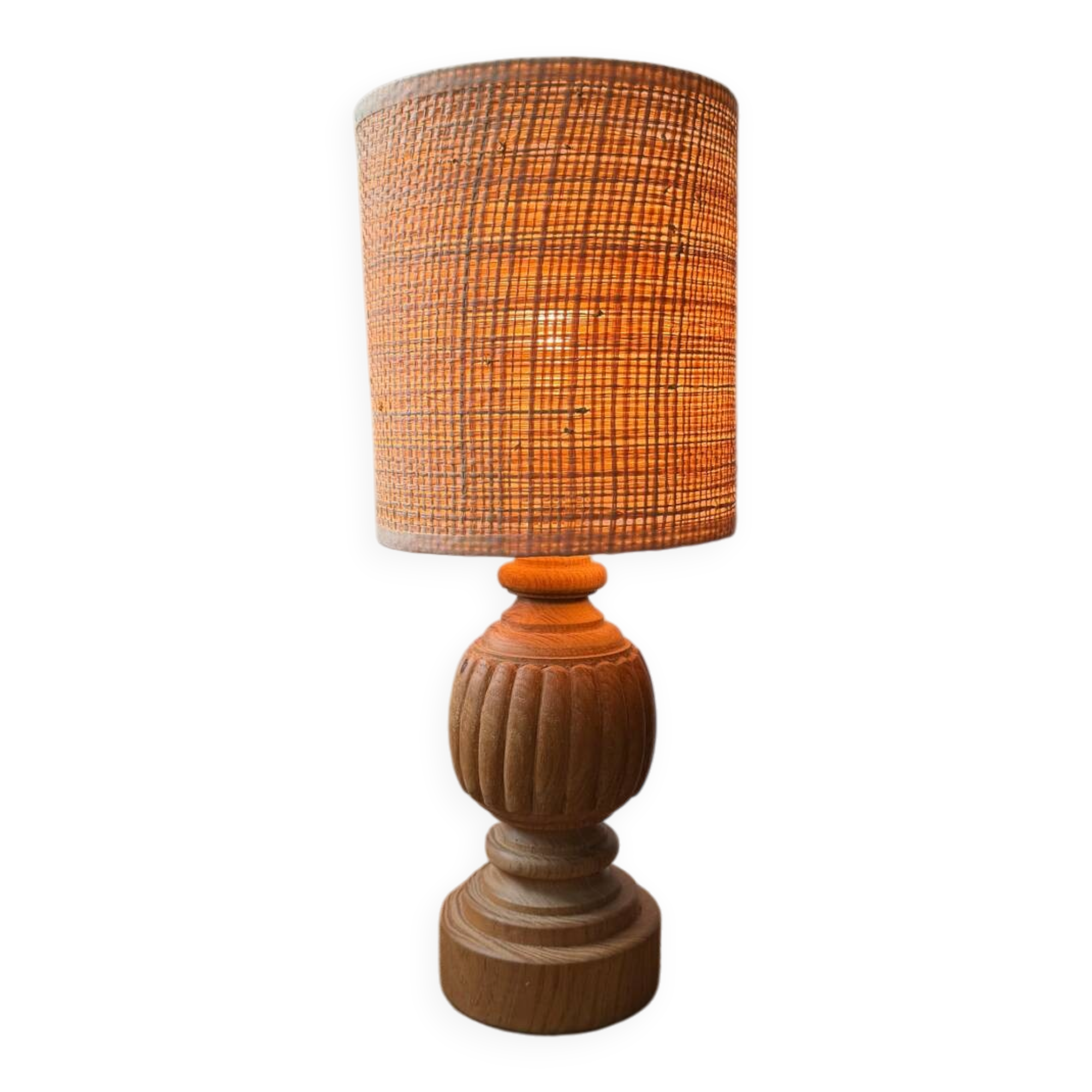 Antique table lamp with a carved wooden base.