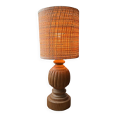 Antique table lamp with a carved wooden base.
