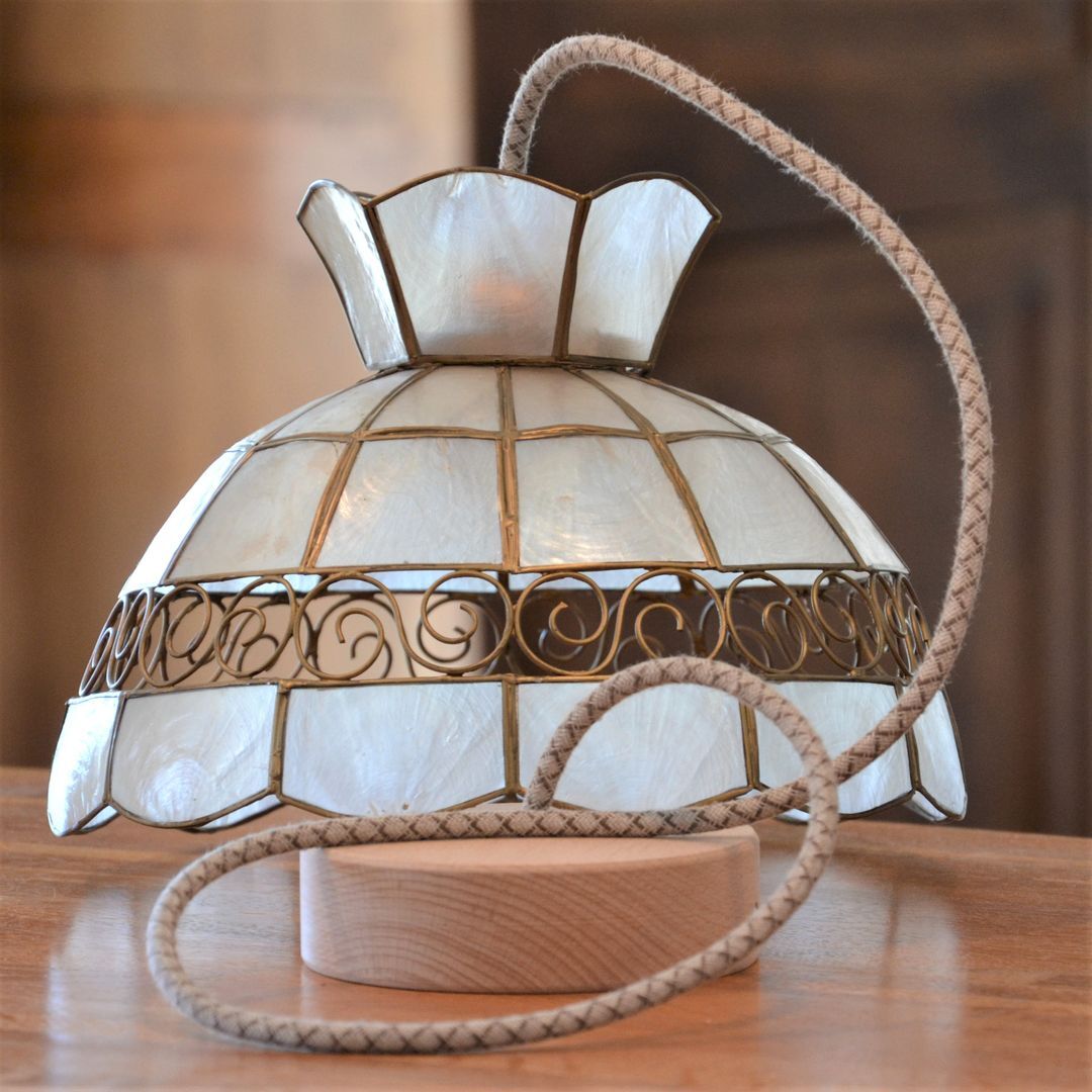 Mother-of-pearl and brass suspension