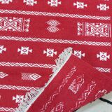 Handmade red and white carpet