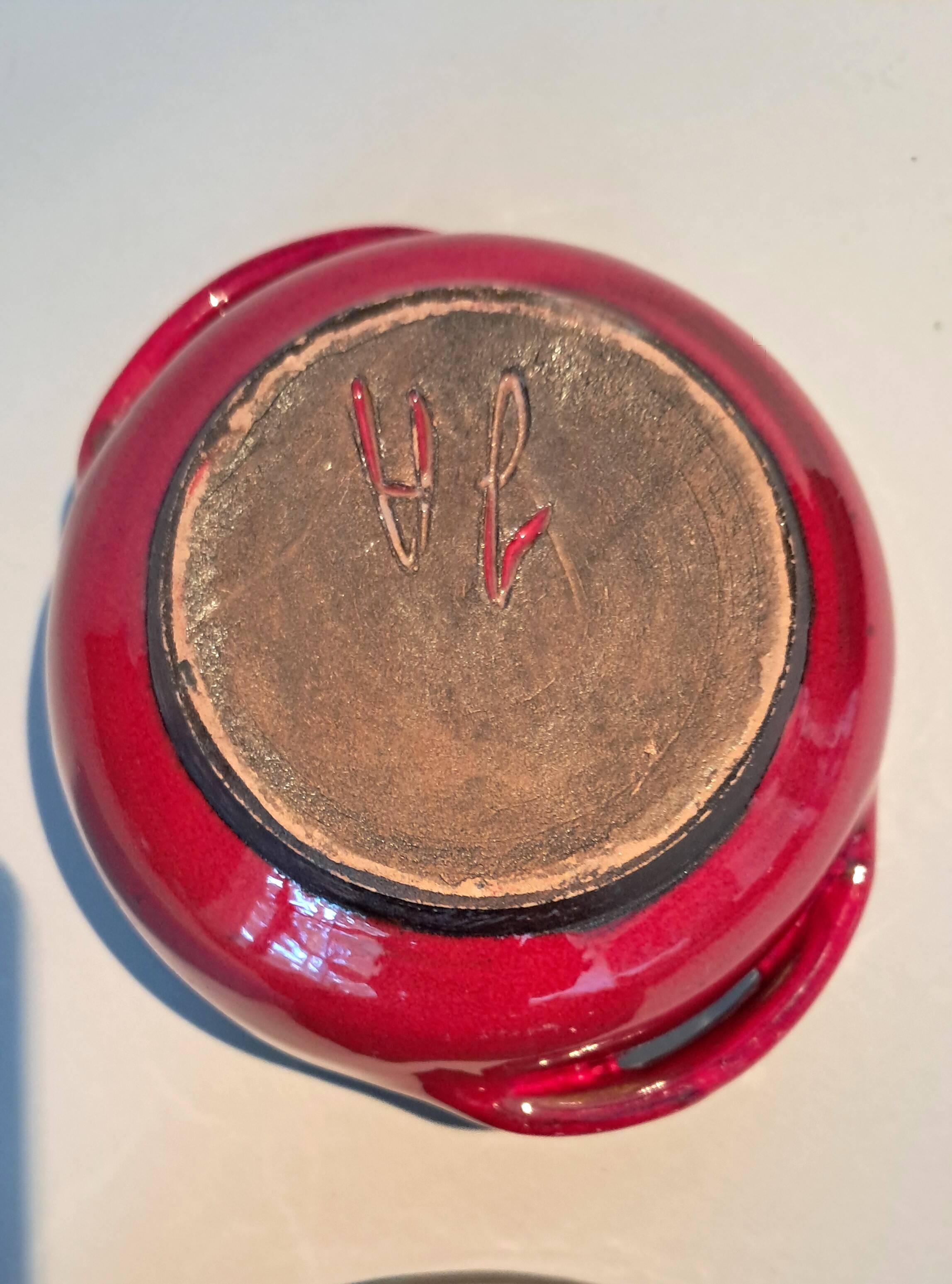 Red ceramic pieces by Gérard Hoffman (1917/1965).