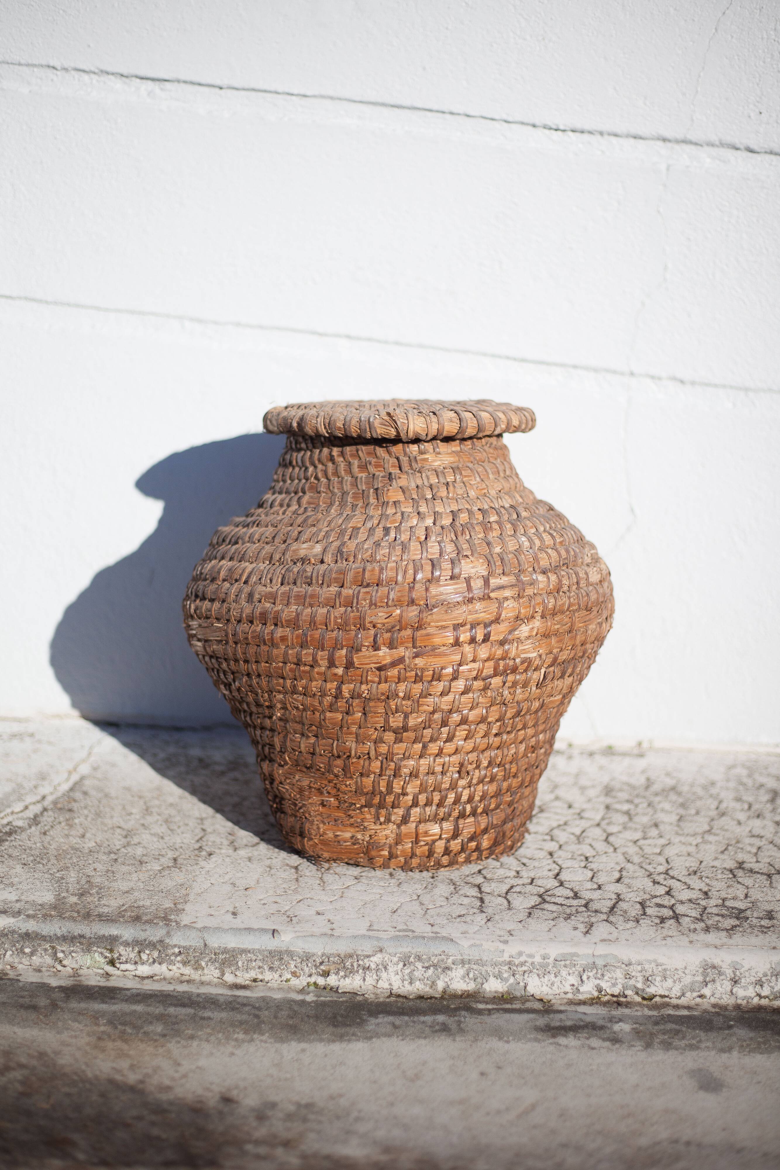 Old basket, burgundy straw and bramble, woven basket with lid, interior decoration, storage