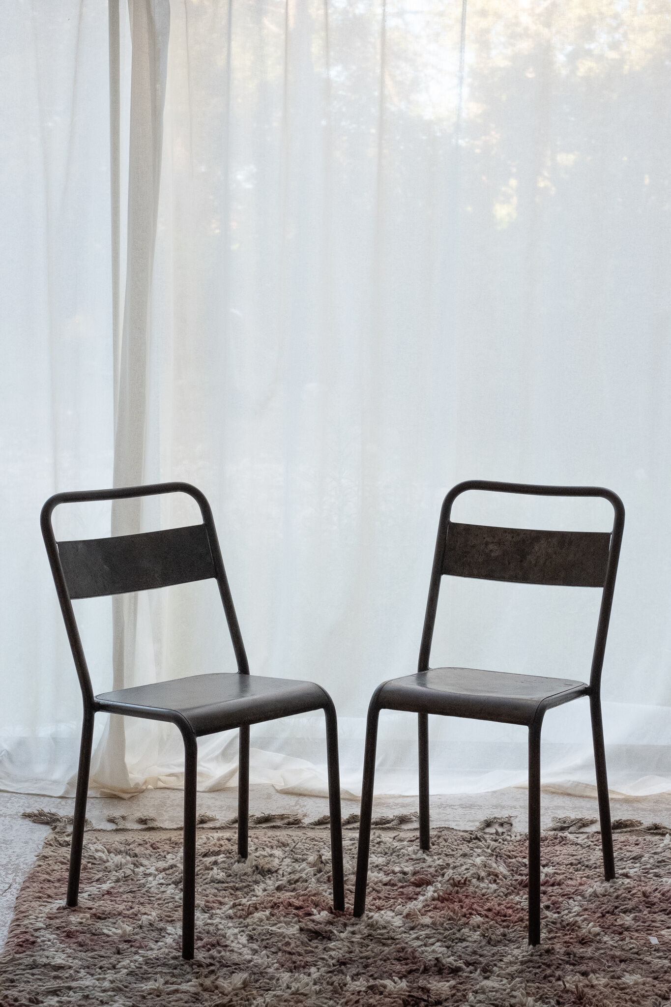 Pair of patinated metal chairs