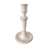 Candle holder on his tin cup