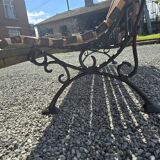Wooden garden bench with cast iron base