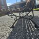 Wooden garden bench with cast iron base