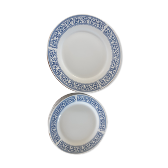 12 white porcelain plates with a blue eder