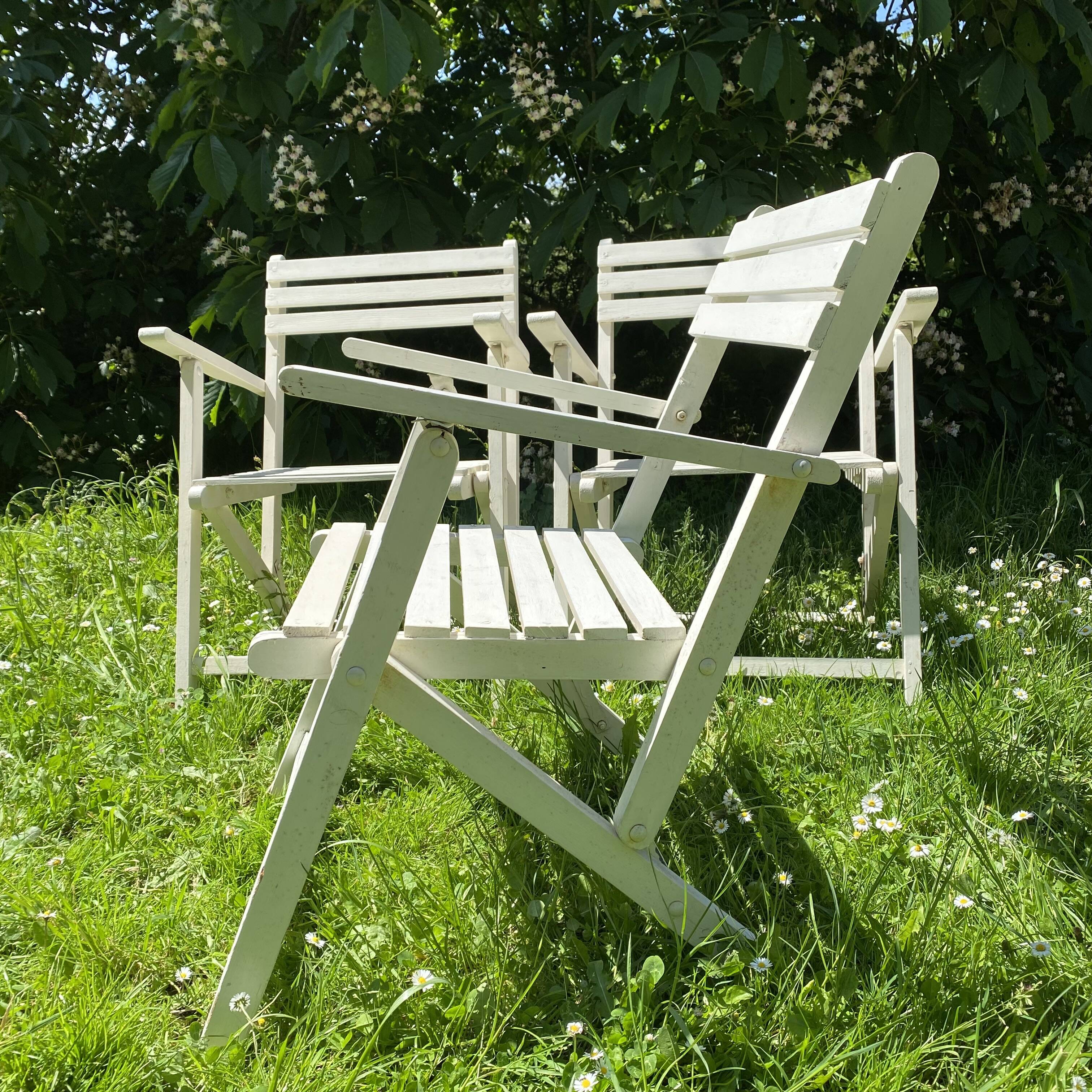 Folding slatted garden armchairs