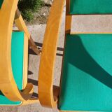 3 vintage bridge chairs with rounded armrests.