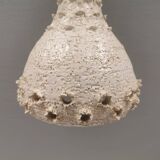 Ceramic hanging lamp in creamy white color that almost looks like a corral