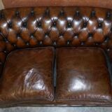 Restored leather Chesterfield sofa, walnut legs.