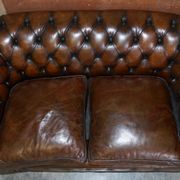 Restored leather Chesterfield sofa, walnut legs.