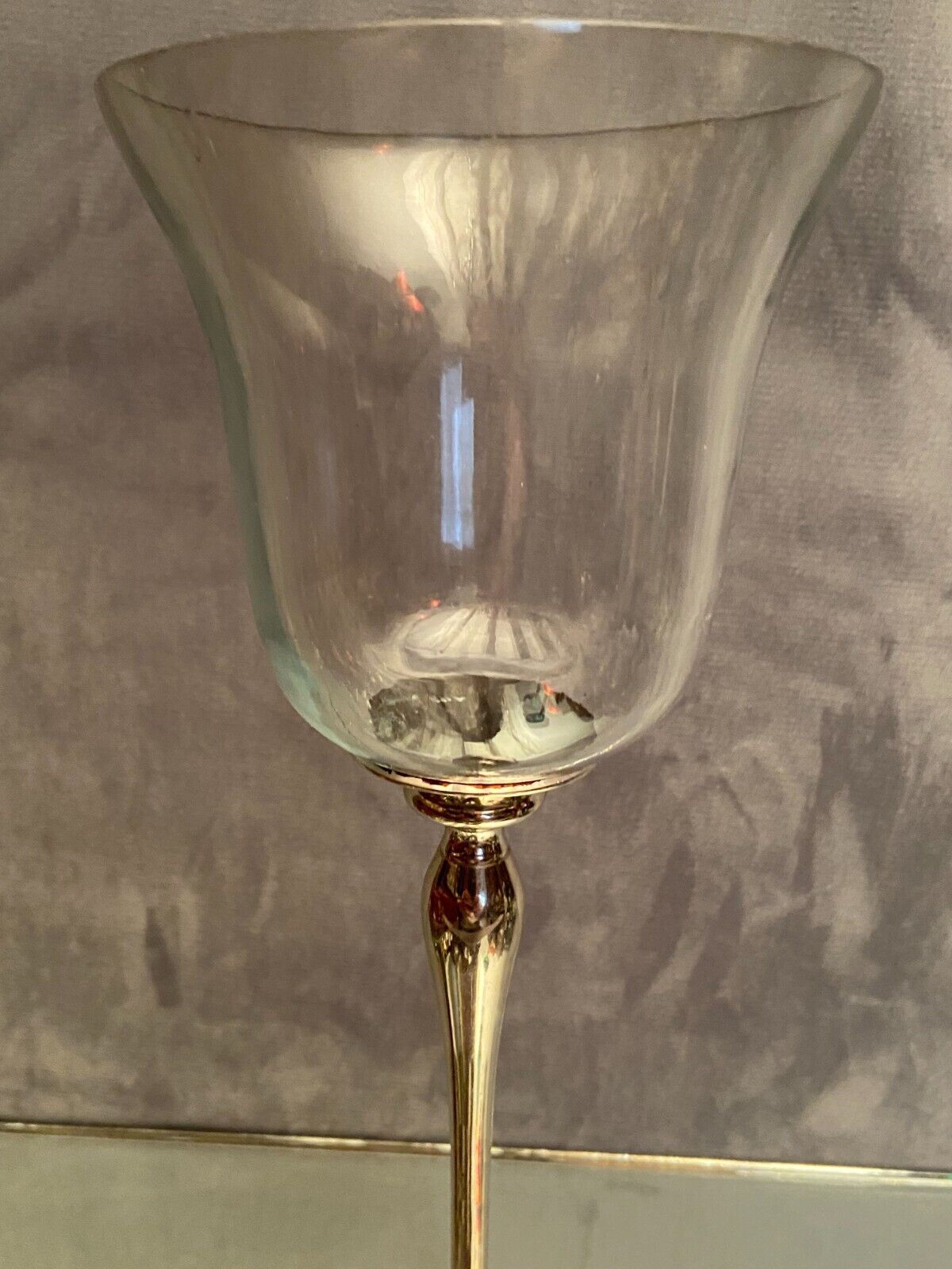 Glass photophore on high metal foot with silver patina