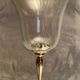 Glass photophore on high metal foot with silver patina